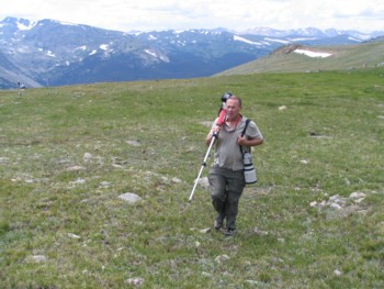 Dad climbing up the mountain to take pictures of elk at Rocky Mountain National Park