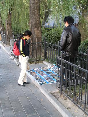 Man selling pirated DVDs at Hohai Park